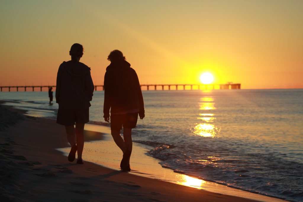 couple walking together at sunset