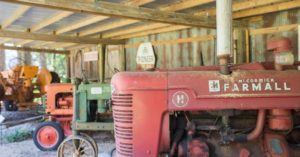 A picture containing tractor, farm machine Description automatically generated